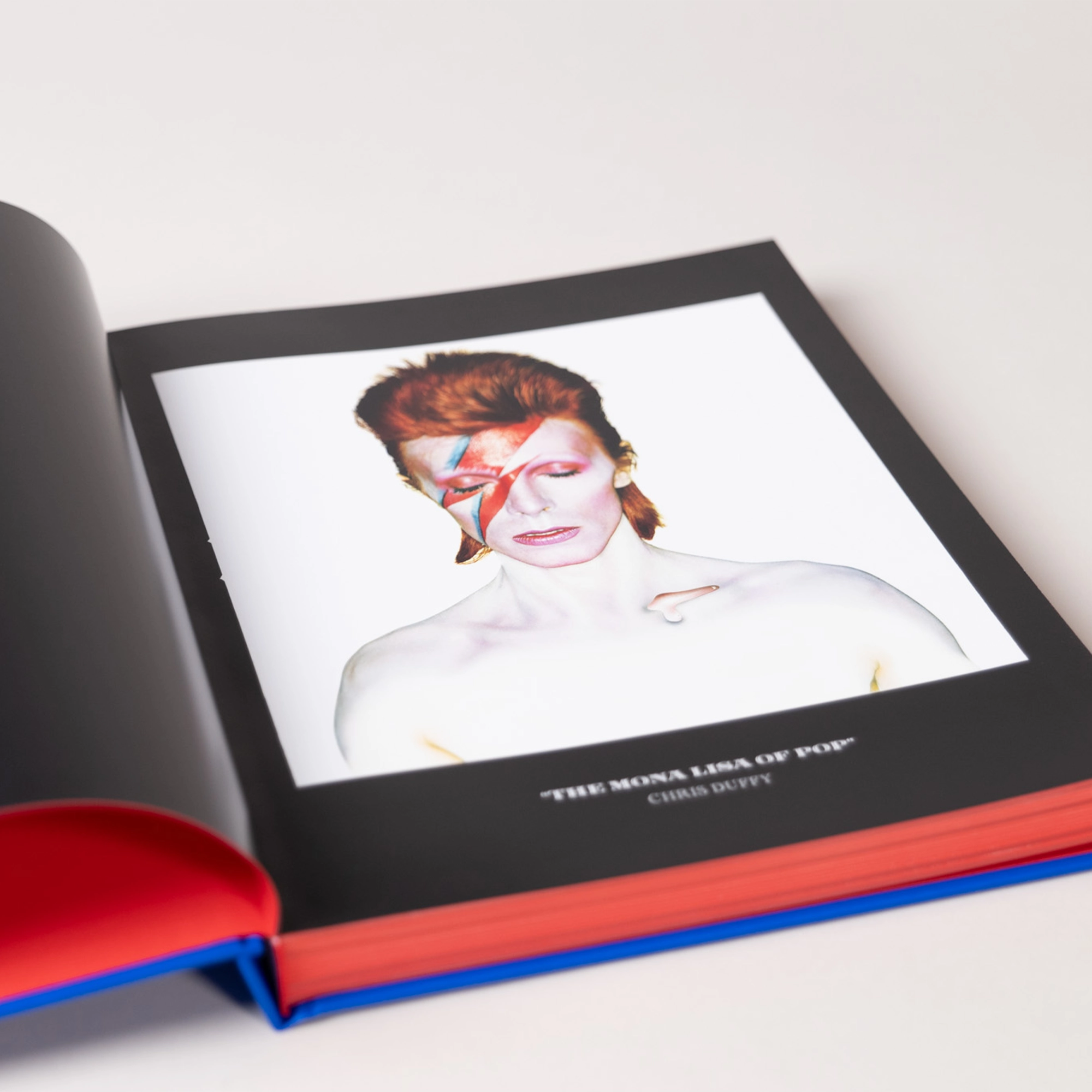 An interior photograph of David Bowie with iconic lightning bolt makeup